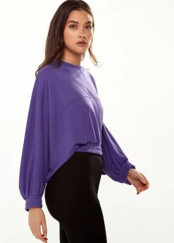Women's Cropped Sweatshirt in Purple with Unique Bat and Balloon Sleeves, Round Neck, and Elastic Cuffs for a Chic Look