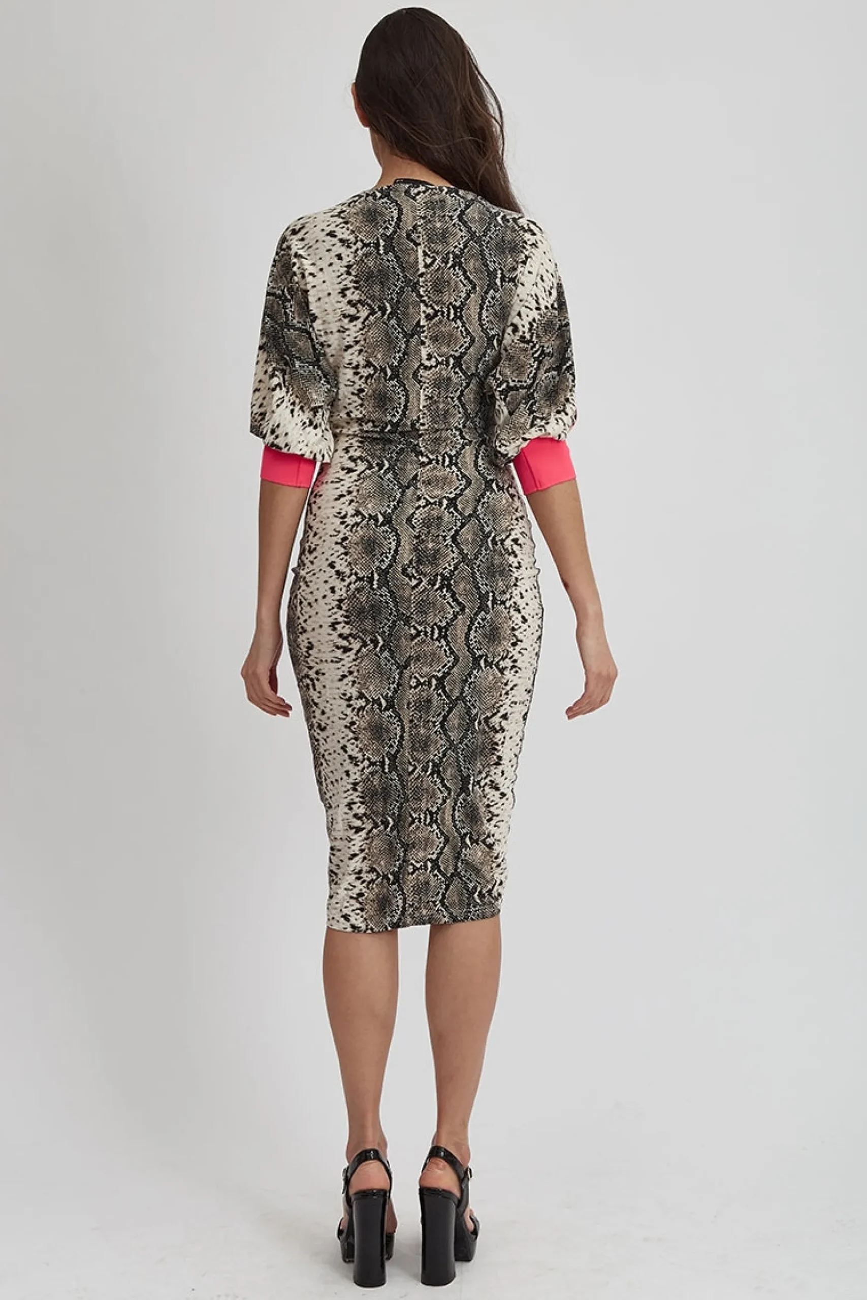 Women's Divine Grace Jersey Dress in Snake Skin Print with Hot Pink Trim, Ruching Front, and Midi Length Design.