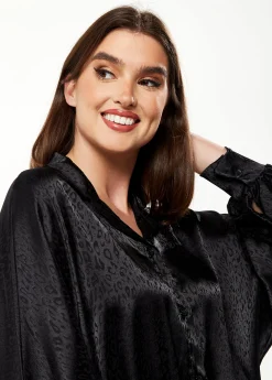 Women's Divine Grace Leopard Jacquard Blouse with Front Waist Tie in Black, Long Sleeves, Button Front, and Collar.