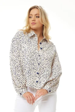 Women's Heart Print Shirt in Cream - Navy hearts, button-up front, heart-shaped buttons, collar, long sleeves, regular fit.