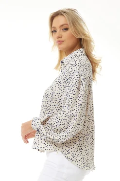 Women's Heart Print Shirt in Cream - Navy hearts, button-up front, heart-shaped buttons, collar, long sleeves, regular fit.