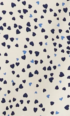 Women's Heart Print Shirt in Cream - Navy hearts, button-up front, heart-shaped buttons, collar, long sleeves, regular fit.