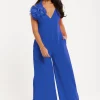 Women's Jumpsuit - Elegant Blue with Floral Shoulder Detail, Deep V-Neck, Wide-Leg Silhouette, Side Pockets, Liquorish