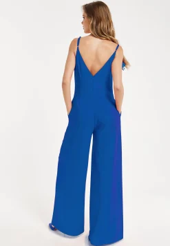 Women's Jumpsuit - Elegant Blue with Floral Shoulder Detail, Deep V-Neck, Wide-Leg Silhouette, Side Pockets, Liquorish