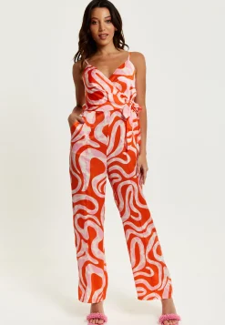 Women's Jumpsuit in Pink and Red Abstract Print with V Neck, Crossover Front, Tie Waist, Wide Legs - Liquorish