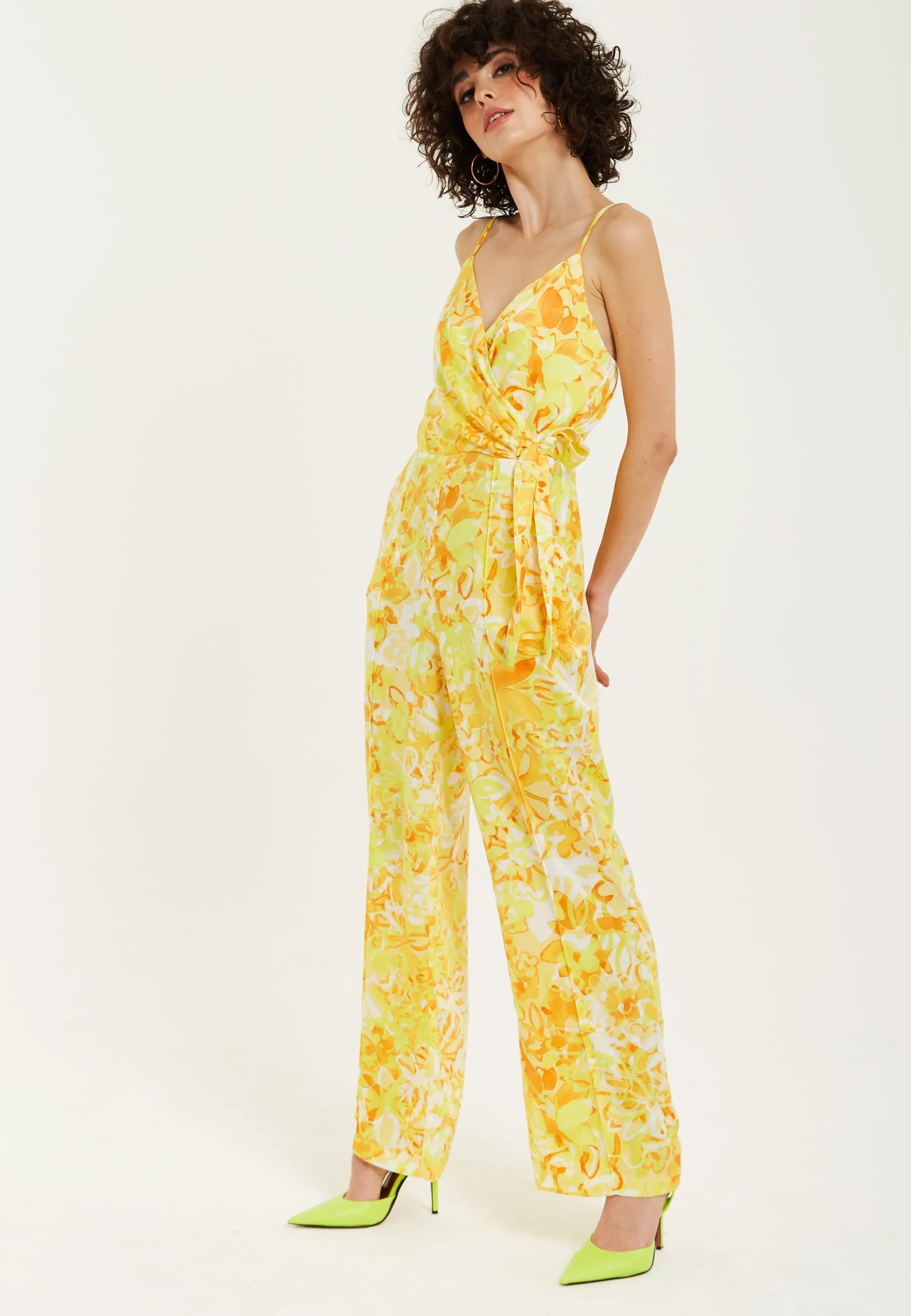 Women's Jumpsuit in Yellow and Orange Floral Print with V-Neck, Adjustable Straps, and Tie Waist - Liquorish