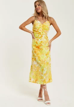 Women's Maxi Dress in Yellow and Orange Floral Print with Sleeveless Design and Ruching Detail - Liquorish
