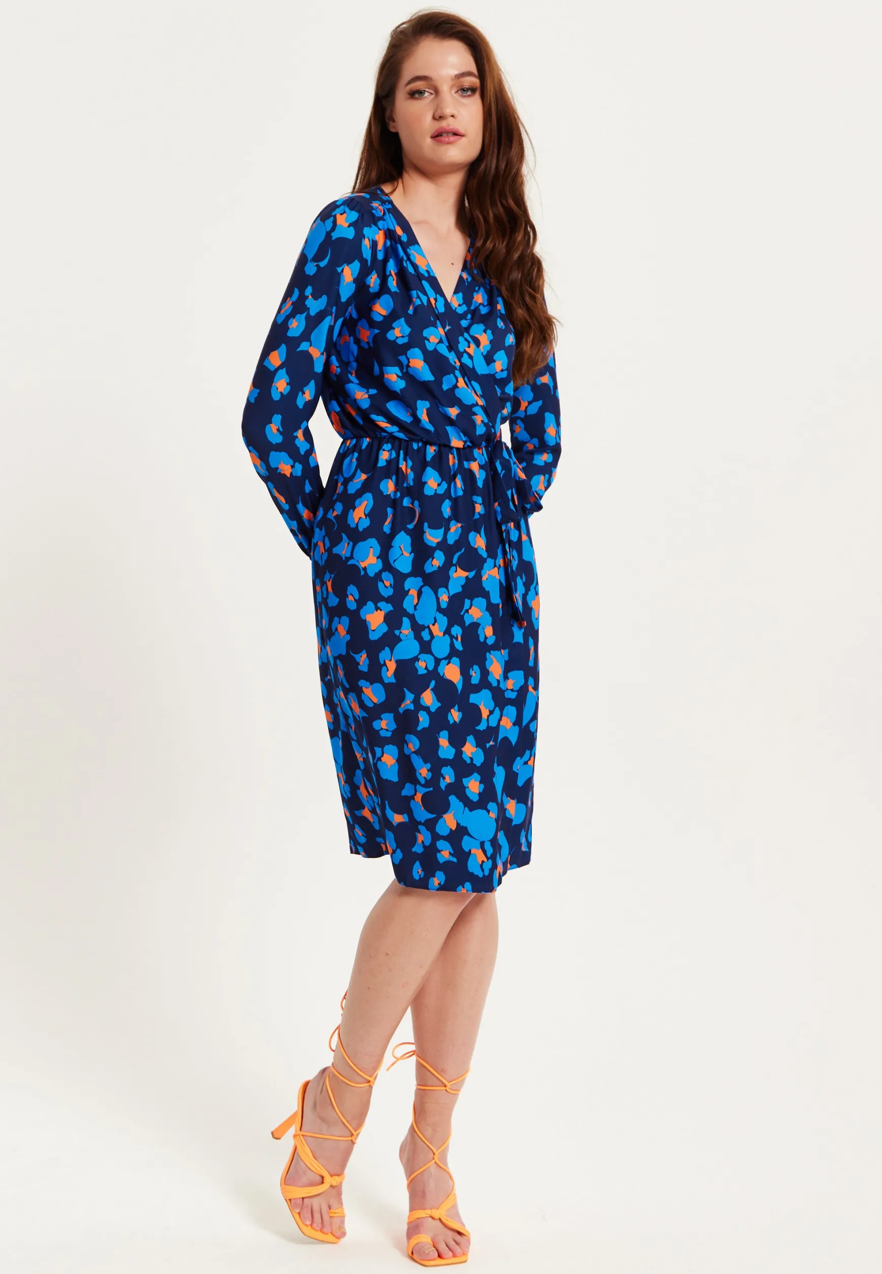 Women's Midi Wrap Dress in Blue with Long Sleeves - Elegant Abstract Print Design by Liquorish