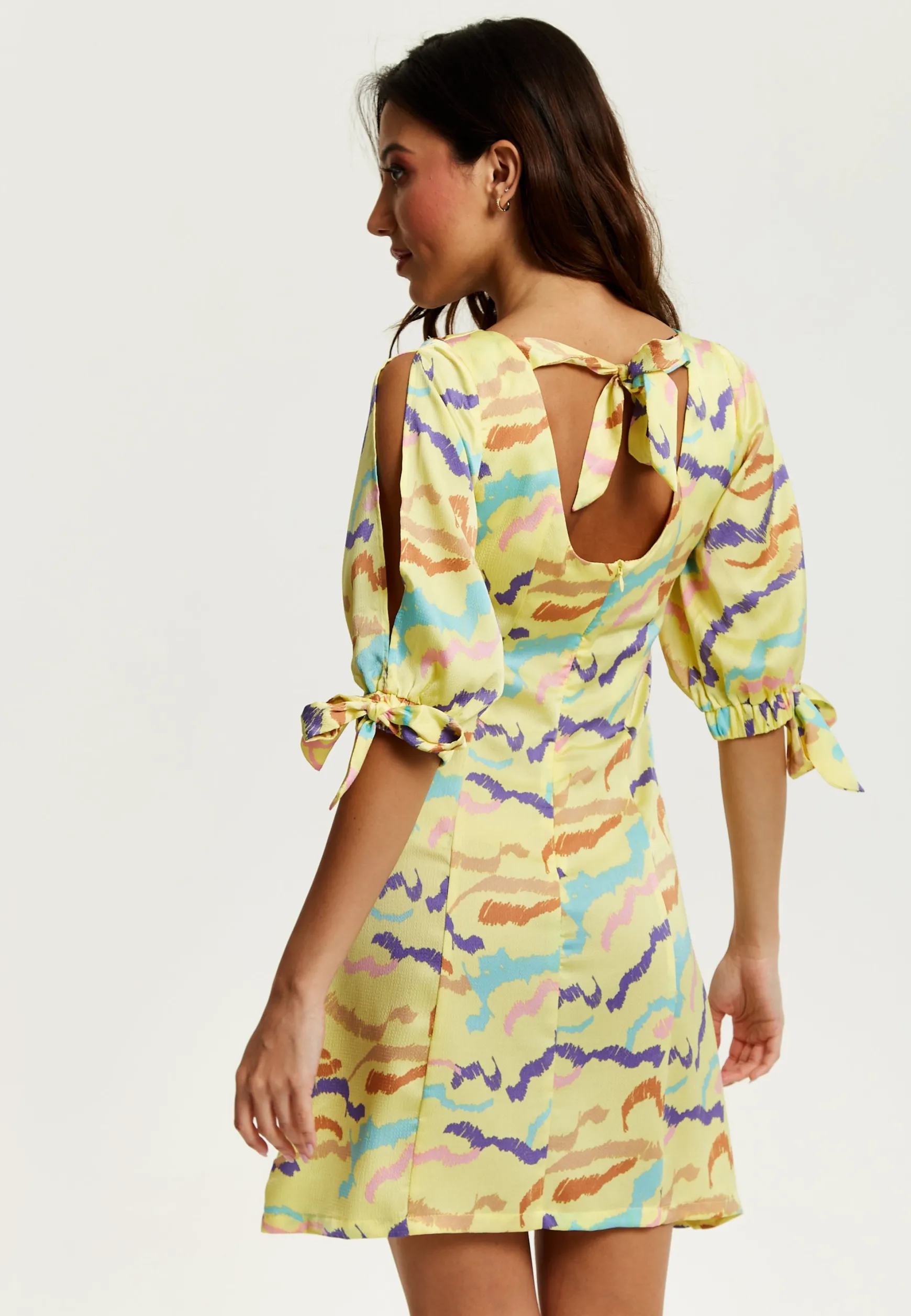 Women's Mini Dress in Yellow with Sleeve Tie-Ups and Back Tie-Up Detail - Abstract Zebra Print by Liquorish