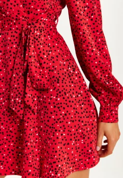 Women's Mini Dress with Long Sleeves in Red - Heart Print Wrap Style, V Neck, Adjustable Tie Waist, by Liquorish