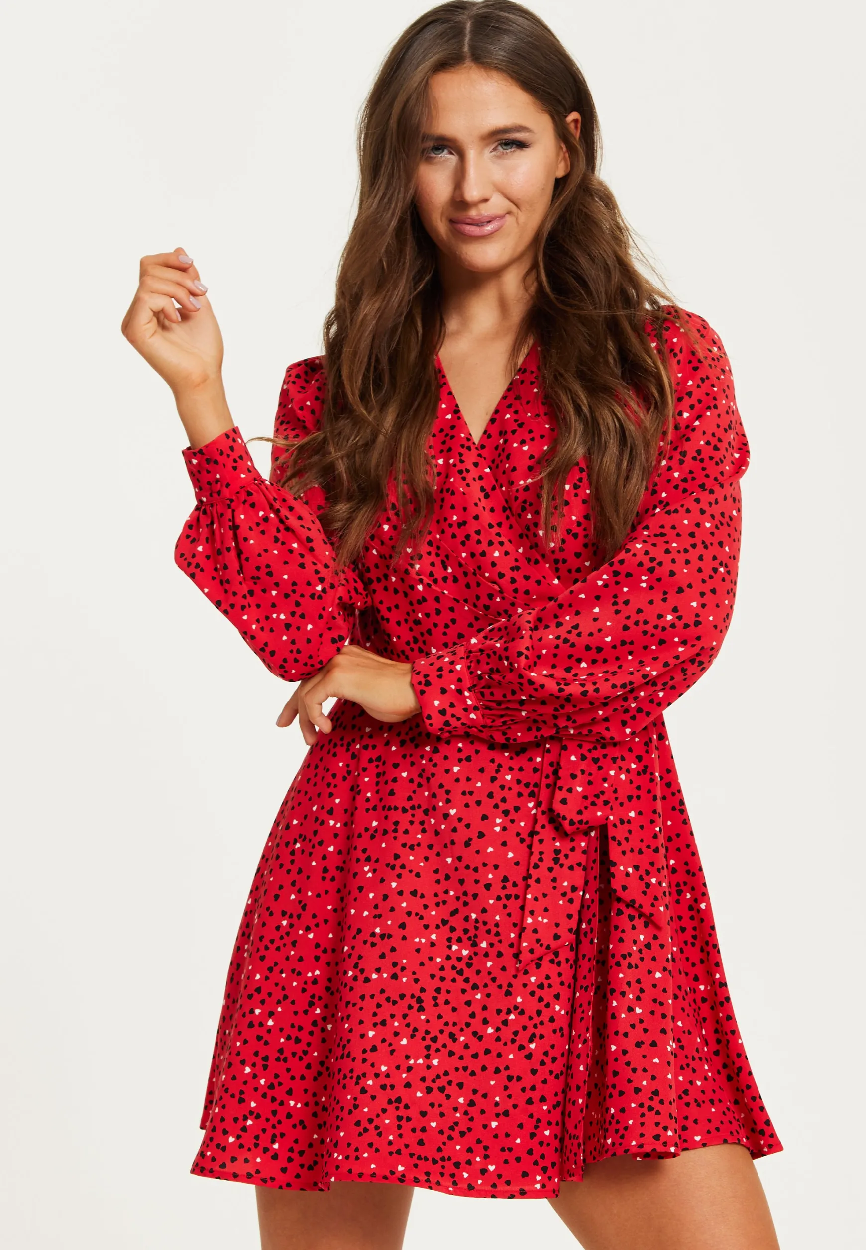 Women's Mini Dress with Long Sleeves in Red - Heart Print Wrap Style, V Neck, Adjustable Tie Waist, by Liquorish