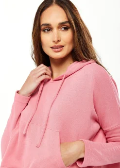 Women's Oversized Hooded Sweatshirt with Front Pocket in Pink - Stylish, Comfortable, with Side Slits and Adjustable Hood