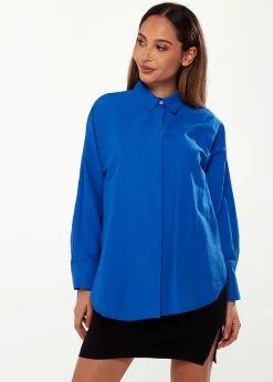 Women’s Shirt in Blue with Point Collar, Button Placket, Loose Fit, and Cuffs – Perfect for Any Occasion.