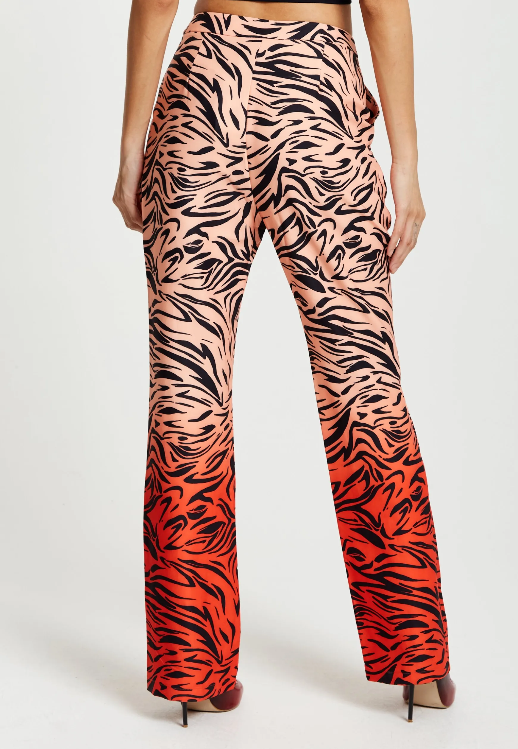 Women's Trousers in Orange and Nude Zebra Print with Slit Detail and Button Closure by Liquorish