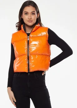 Women's Wet Look Gilet in Orange - Sleeveless, High Neck, Zip Closure, Cropped Fit, Regular Fit, Available in Classic and Bright Colours.