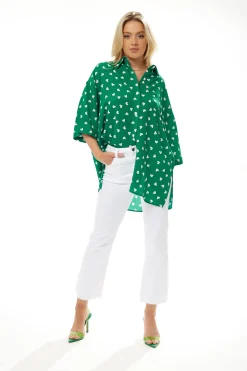 Women's White Heart Print Shirt in Green - Short sleeves, oversized fit, heart-shaped buttons, button-up front, collar.